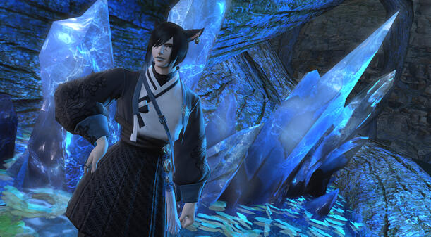 simple screenshot of alas'to in a blue and white dress in front of blue crystals